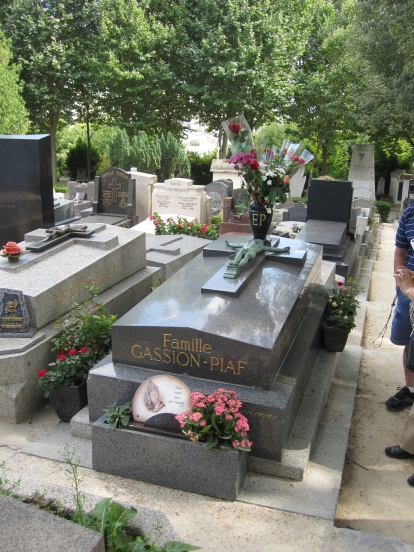 Edith Piaf's grave, where I had to wait on an extremely rude French family followe by an even ruder Spanish family to get close. The Spanish family is actually still there, on the right. You can see their feet as they moved to the side of the gravesite and apparently attempted to teach themselves how to say her name.